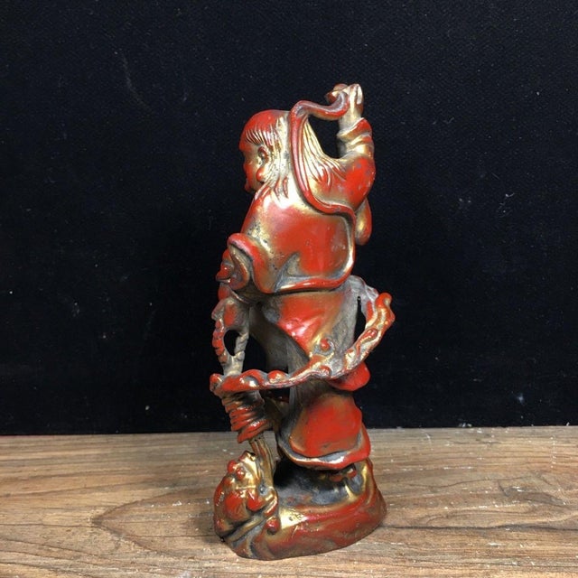 This charming vintage Chinese sculpture is crafted from bronze, featuring a rich, dark patina with vibrant red and gold...