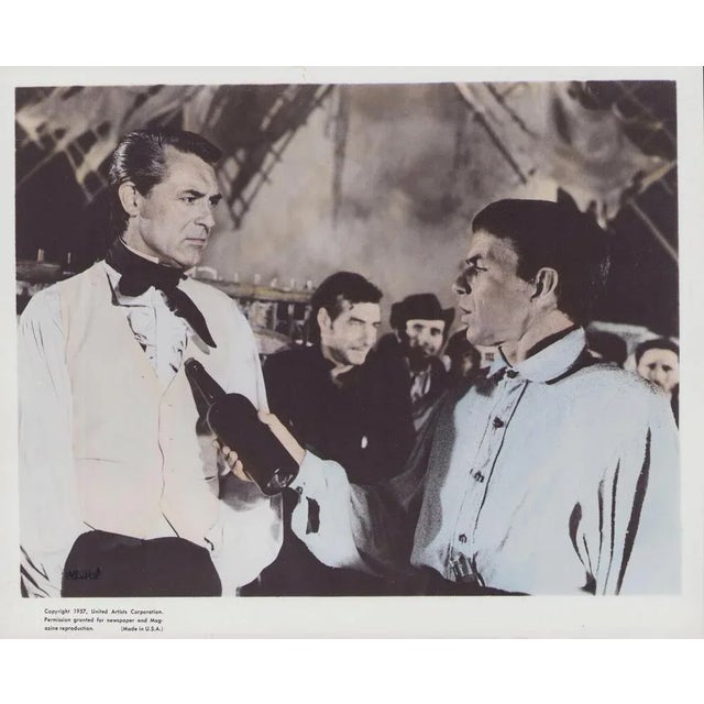 Original color lobby card for the film "The Pride and the Passion" (1957) featuring Cary Grant and Frank Sinatra. This...