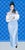 This oil on canvas artwork features a figure elegantly draped in a light blue gown, holding a coffee cup, exuding a sense...