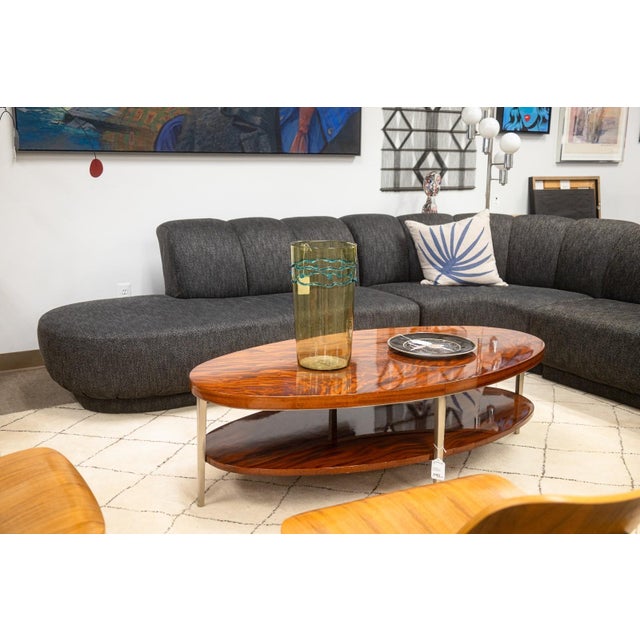 A vintage Greg Sheres Italian mahogany Verite collection cocktail coffee table. This chic coffee table designed by Sheres...