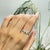 The Four-Stone Marquise-Cut Moissanite Butterfly Cocktail Ring features four marquise-shaped stones arranged in a...