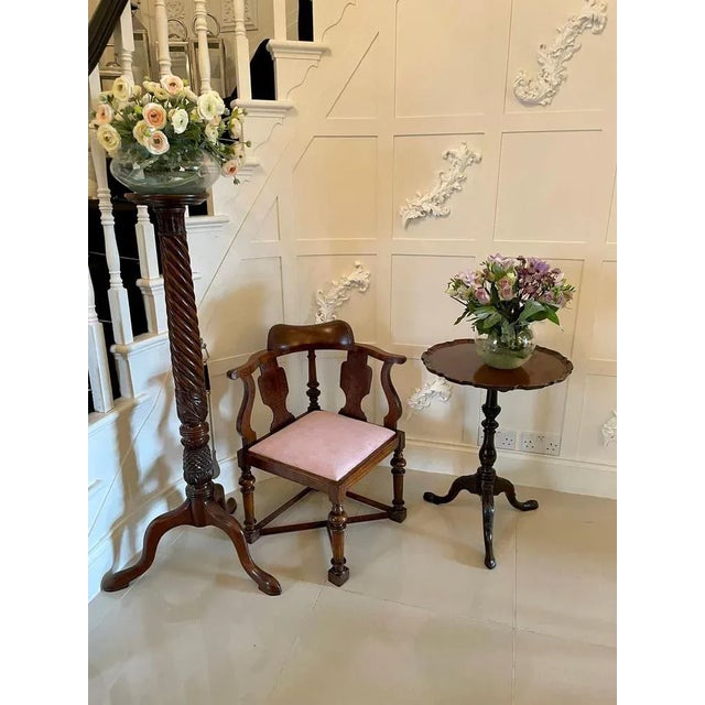 Unusual antique victorian oak corner chair having a quality shaped top rail supported by a turned column, shaped splats,...