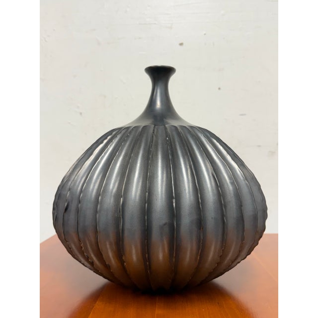 Design Plus Gallery presents the Ceramic Fluted Vase from Studio A Home by Global Views. This sculptural vase has a...
