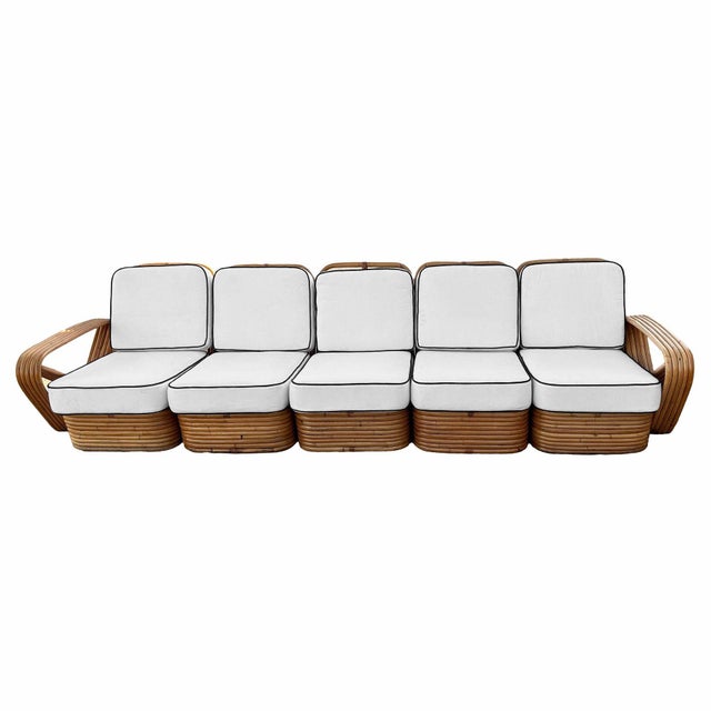 This beautifully restored rattan sofa seamlessly blends style, vintage charm, and modern comfort, featuring a 5-seater...