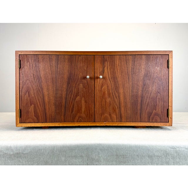A beautiful mid century modern walnut cabinet, circa 1960’s. Ideal for vinyl record, books or other media storage. Nicely...