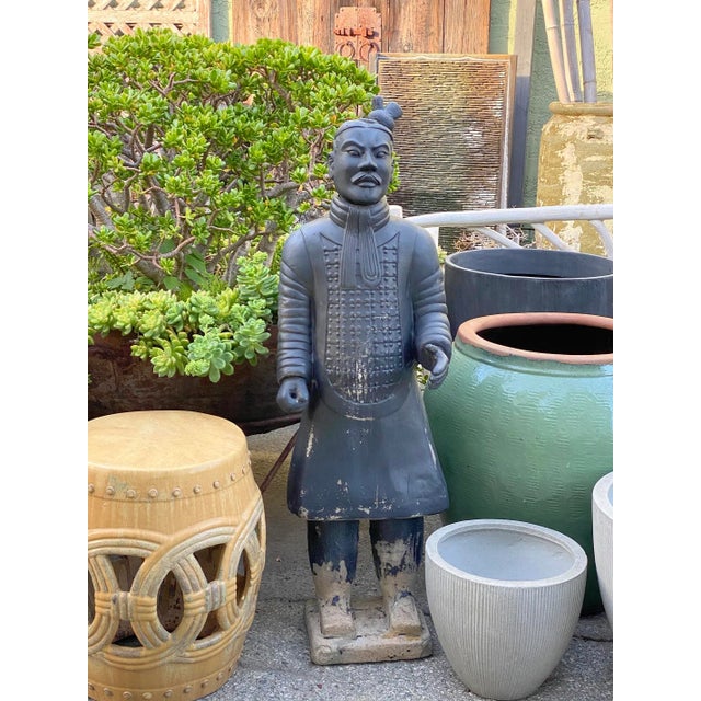 Terra cotta warrior statue. Small size replica of the traditional unearthed Chinese terra cotta warrior statues. Black...