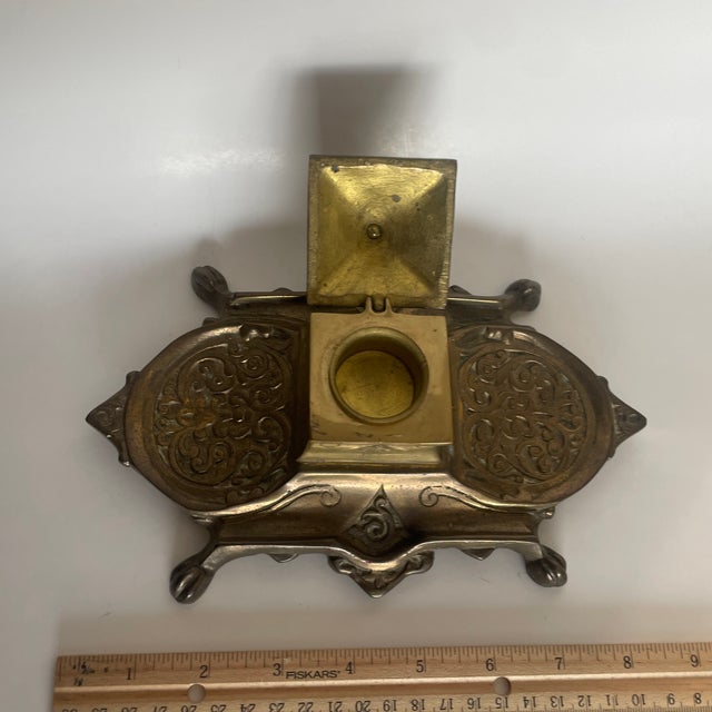 Vintage solid brass desk inkwell with ornate Victorian-style detailing. Heavy cast brass construction with hinged lid and...