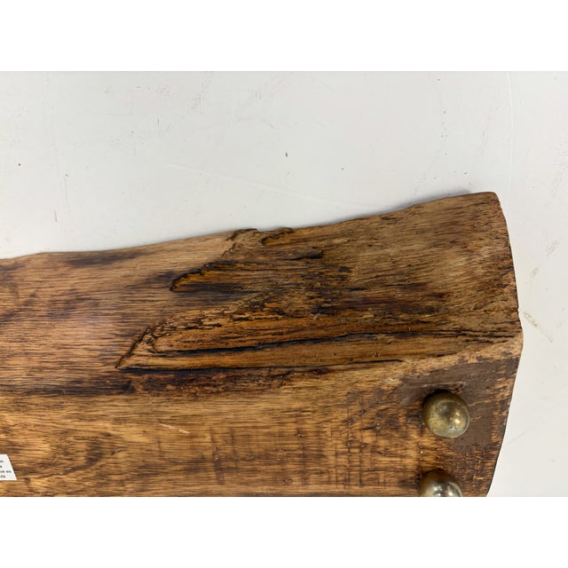 Hand carved wooden small dough bowl made in India with elongated rectangular form and natural live-edge shape. Carved from...
