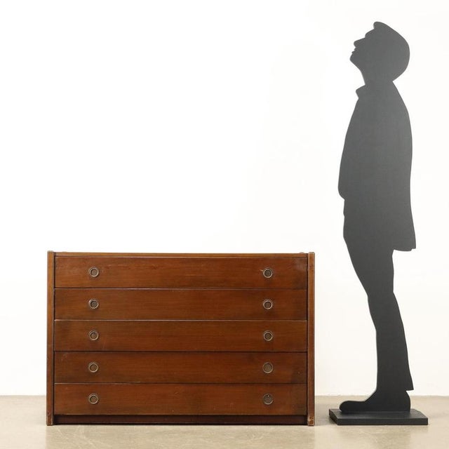 Dresser, in stained walnut veneered wood. This piece is attributed to the mentioned designer/maker. It has no attribution...