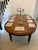A handsome antique mahogany wind out dining table with a lovely rich colour and well figured top. The table is raised on...