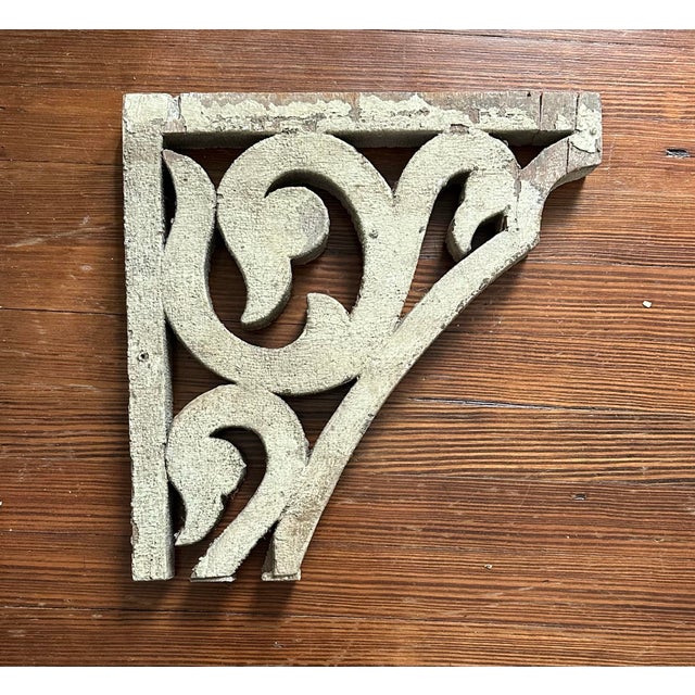 A gorgeous, antique wood corbel fragment. Features a scrolled, swan head bracket detail with a distressed finish in...