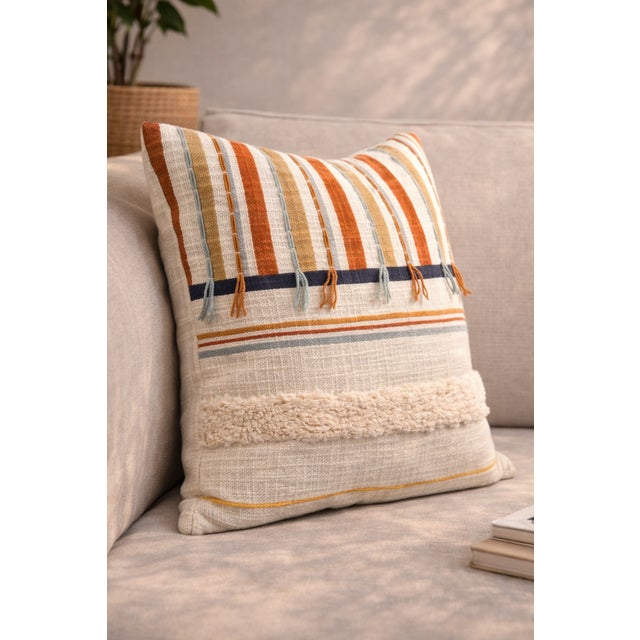 Elevate your space with this beautifully crafted cushion cover featuring a blend of woven textures, earthy stripes, and...