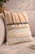Elevate your space with this beautifully crafted cushion cover featuring a blend of woven textures, earthy stripes, and...