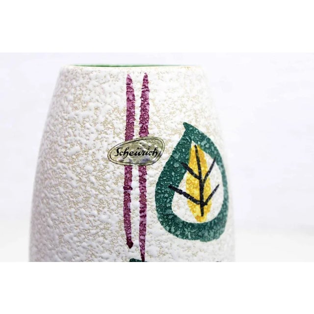 Oli ceramic vase from the 60s and 70s West Germany by Scheurich Keramik. Ideal for accommodating small bouquets, this...