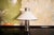 Table lamp with chromed metal frame and acrylic shade. Designer attributed to Harvey Guzzini 1960s This piece is...