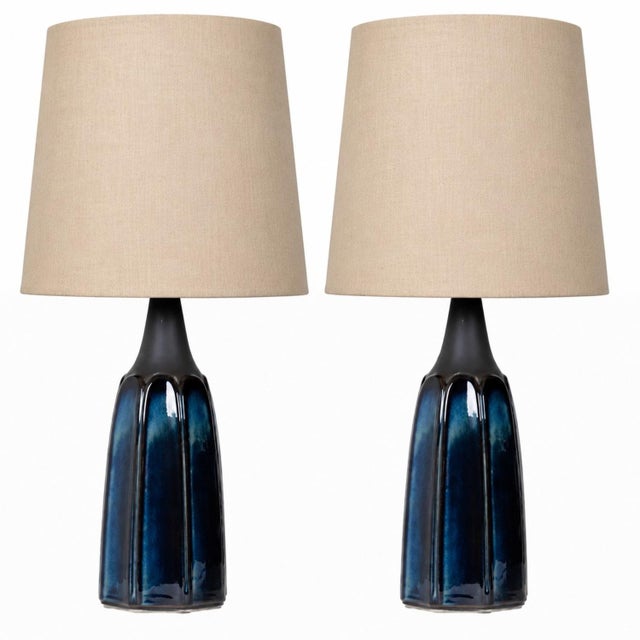 Pair of vintage porcelain Scandinavian table lamps from the 1960’s, each lamp is a unique blue porcelain with matte...