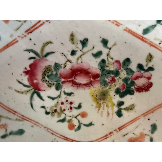 Antique Chinese famille rose footed decorative footed dish, with a diamond-shaped bowl, hand-painted flowers, and a raised...