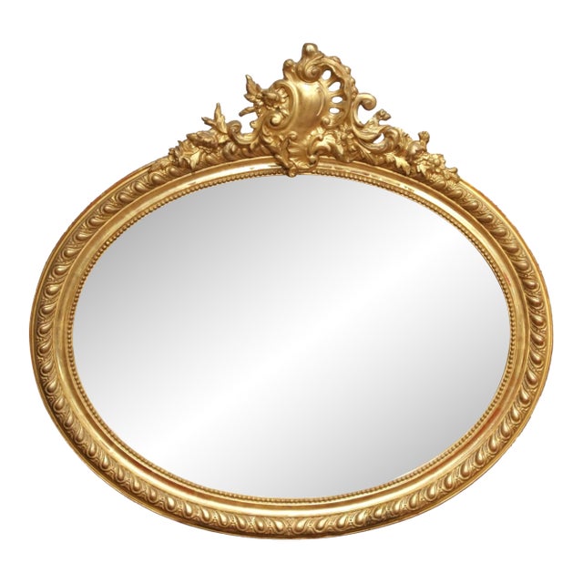 19th Century French Louis XV Oval Giltwood Wall Beveled Mirror With Crest For Sale