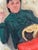 The painting captures a moment in time while taking a break, joined by a cat. I made the figure dressed in green and red,...