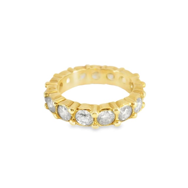 Stunning estate 14K rose gold eternity band featuring 15 brilliant round diamonds totaling 3.8 ct (I-J color, SI clarity)....