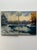This pair of original signed oil-on-canvas diptych depicting a serene winter white lakeside landscape with snow-covered...