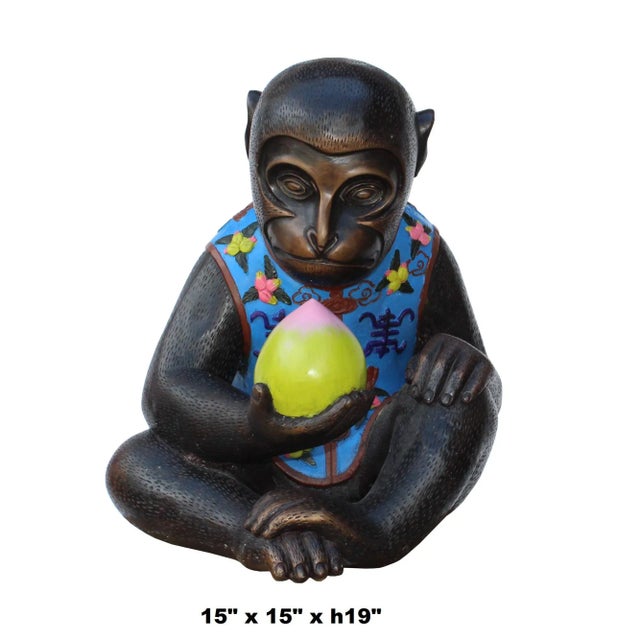 This is an ape monkey figure made of metal in a brown bronze color with precise body pattern details. The dress and the...