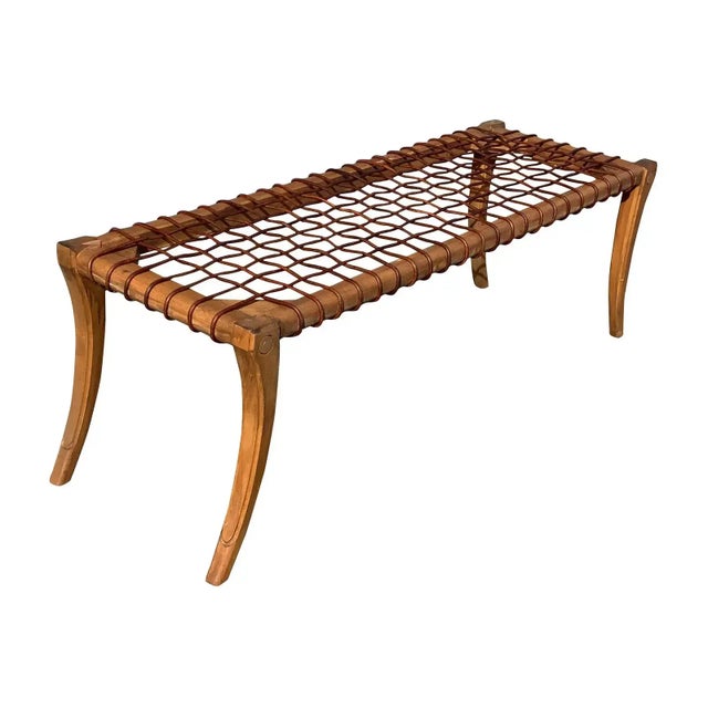 Modern Klismos style ottoman. The ottoman is made of alder. The finish is walnut. The cording is leather. The Klismos...