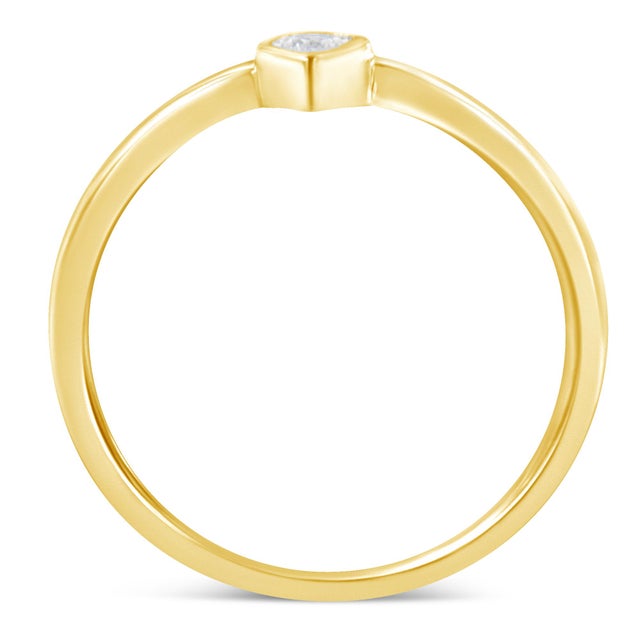 This delicate ring features a sparkling white diamond set in a band crafted in 2 micron 14 karat gold plated sterling...