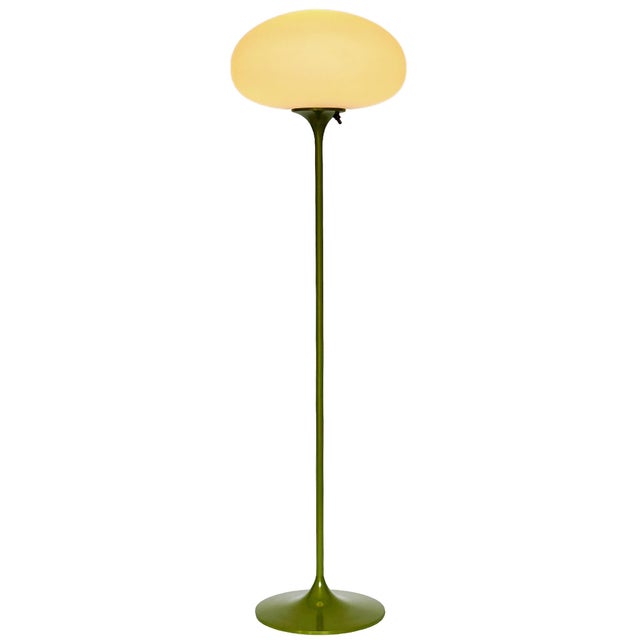 A sleek low profile floor made by Design-Line. It features a cast aluminum main base in a sculptural tulip form. The lamp...