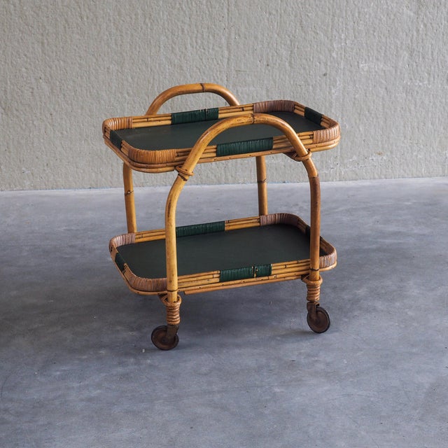 Original 1950s bamboo serving trolley/ bar cart. Crafted with warm, bent bamboo framing and distinct deep green wrapping...
