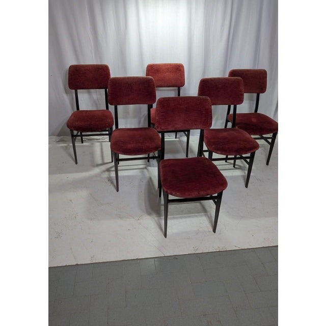 Embrace the height of Mid-Century Modern sophistication with this set of six dining chairs by the celebrated Italian...