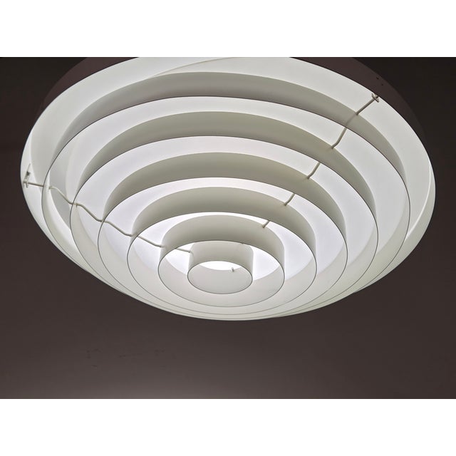 Ceiling lamp model 71-148, design by Lisa Johansson-Pape and manufactured by Orno. In working condition. This piece has an...