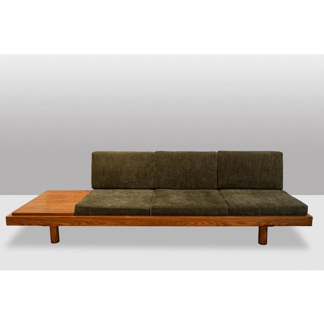 Pierre Chapo. “L09” model bench, solid natural elm frame, three olive green velvet seats, and a removable elm top. France,...