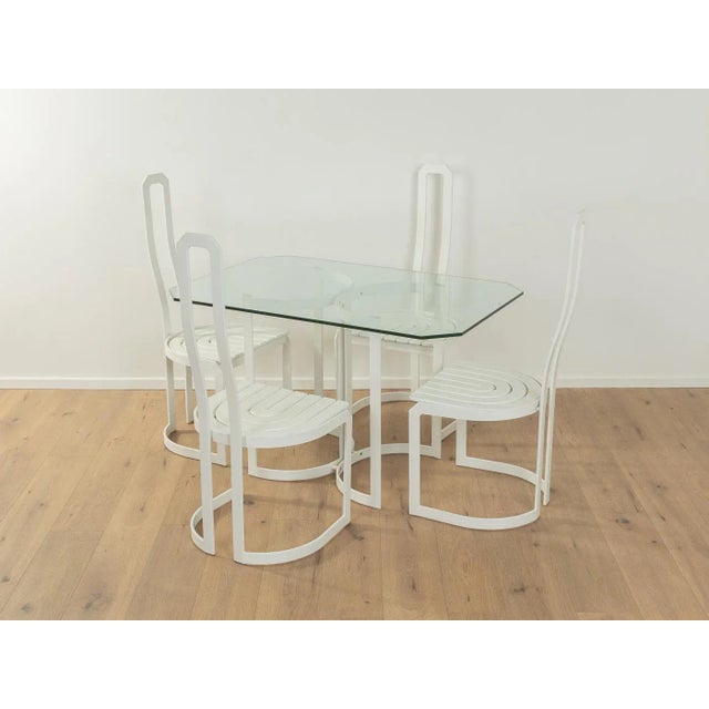 Postmodern dining chairs by Allmilmö from the 1980s. White lacquered stainless steel frame with a white lacquered ash...