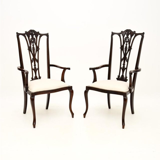 A beautifully made pair of antique Chippendale style armchairs. They were made in England, they date from around the...