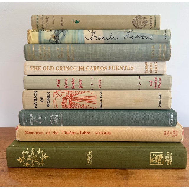 Cozy set of 9 bedside books, in colors which conjure the romantic image of a gray day by the sea. The Old Gringo by Carlos...