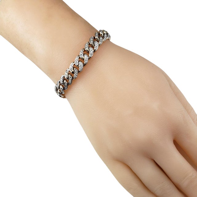 14 Karat Yellow Gold and Diamond Curb Link Bracelet JAGi Certified- Add timeless luxury to your collection with this...
