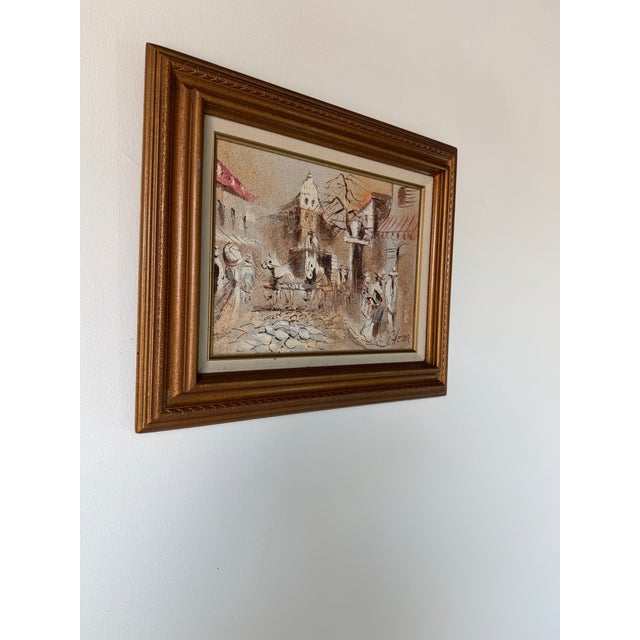A charming Parisian street scene by American artist Boris Chezar (1913–2008), executed in oil and sand on canvas. The...
