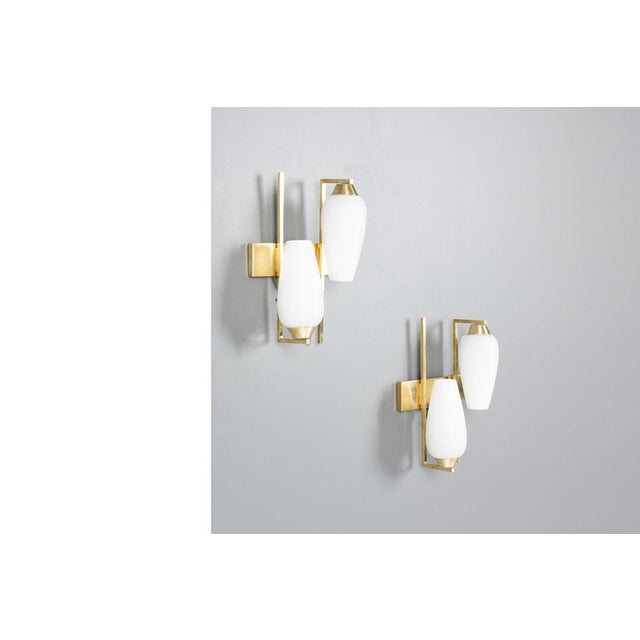 This elegant pair of French wall sconces from the 1950s embodies the refined simplicity of mid-century modern design. Each...