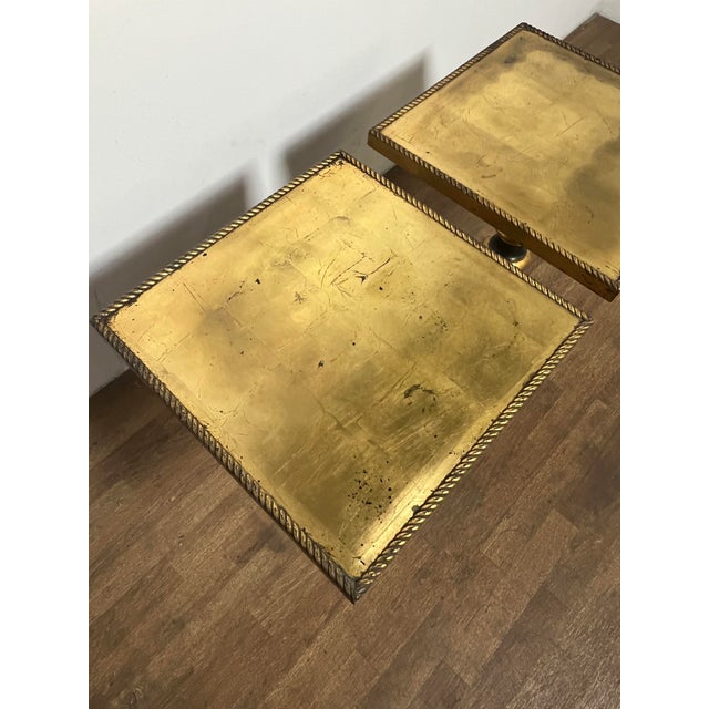 A pair of lacquered and gold leafed neoclassical side tables with braided molding, ca. 1960s.