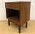 Midcentury Modern walnut Stanley nightstand with a single drawer and original hardware and an open space below for storage...
