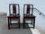Pair of Chinoiserie Style Carved Wood Hall Chairs. they feature carved back splats and a decorative base. Solid slab seat...