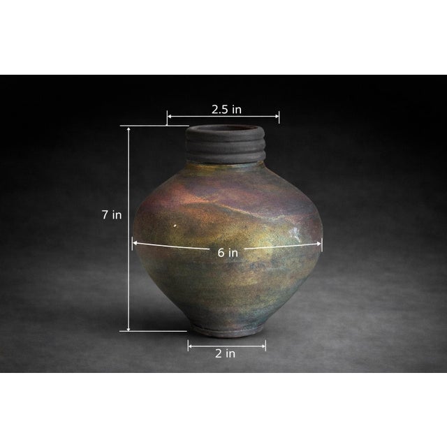 Mobile-Ready Description A beautifully handcrafted studio pottery vessel featuring a luminous iridescent reduction glaze...