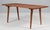 Hans J. Wegner coffee table, solid oilec teak, legs of oiled oak. Made by Andreas Tuck. Model AT11 This piece is...