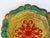 Vintage round composite resin Italian Florentine tray hand-painted in shades of gold, red and green with scalloped rim....