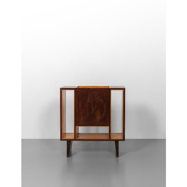 A cabinet to hold sheet music. Mahogany wood veneer and maple wood veneer. Accompanied by certificate no. 24216/000 by Gio...