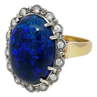 Mid 20th Century 18k Yellow/White Gold Oval Cut Center Opal and Diamond Halo Ring, Size 6.25 For Sale