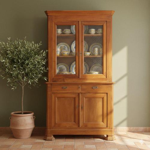 Walnut sideboard. Upper part with worked glass doors, three internal shelves, base with a pair of under-counter drawers...