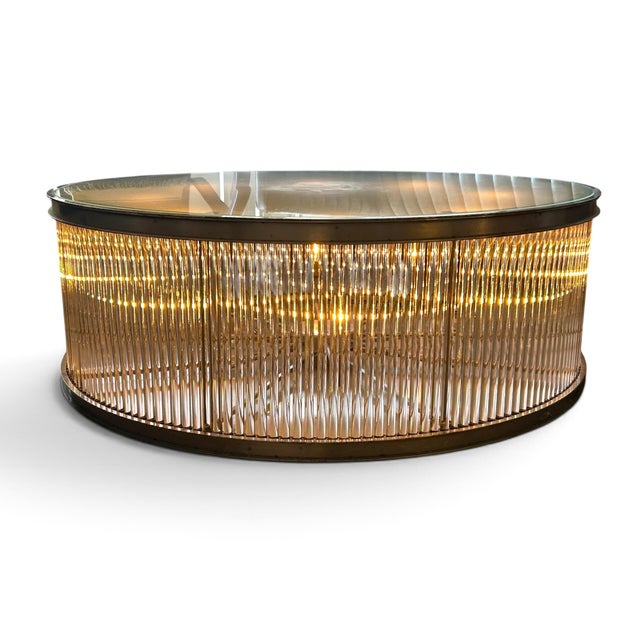 Super glam your space with this stunning lighted metal & glass rob coffee table from Timothy Oulton. 1/2” thick frosted...