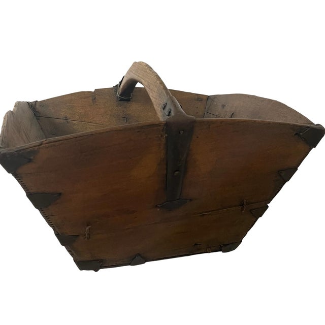 The Antique Chinese Rice Grain Measure Box is a primitive basket made of wood with iron brackets. Originating from China,...